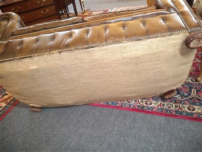 Lot 247 - A modern leather upholstered two-seater chesterfield settee