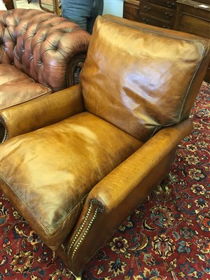 Lot 164 - A pair of brown leather armchairs