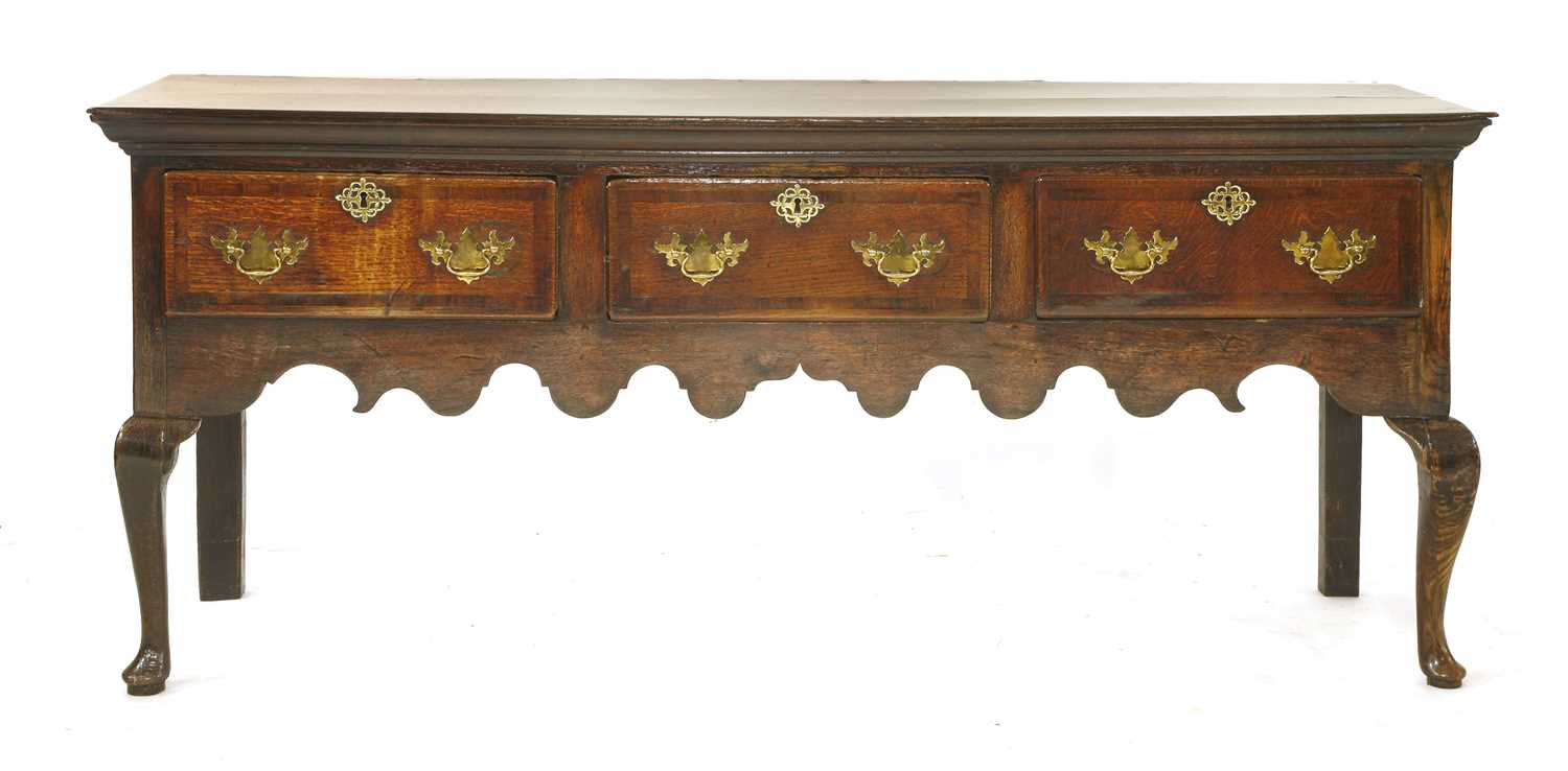 Lot 531 - A George II oak and walnut low dresser
