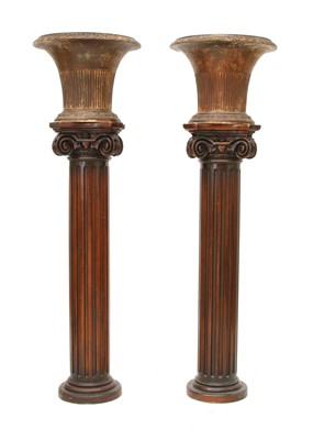 Lot 52 - A pair of iron urns