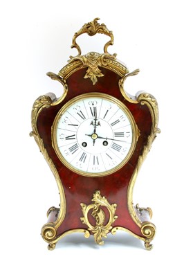 Lot 225 - A French tortoiseshell and gilt bronze mantel clock