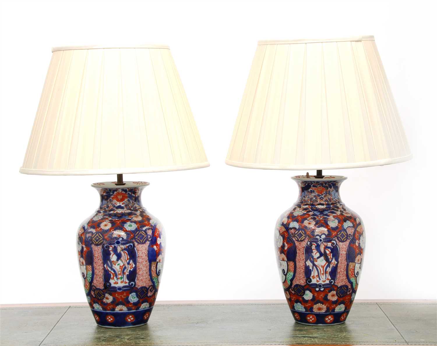 Lot 132 - A pair of Imari vase table lamps