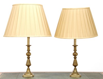 Lot 299 - A pair of brass candlestick table lamps
