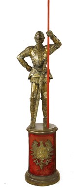 Lot 782 - A brass figure of a Knight in armour