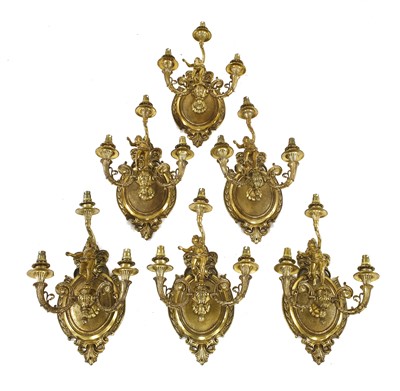 Lot 665 - Six three-branch gilt metal wall lights