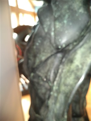 Lot 22 - A pair of life-sized green patinated bronze blackamoors
