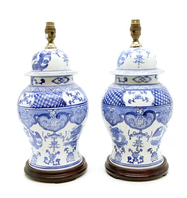 Lot 144 - A pair of Chinese blue and white lidded urns