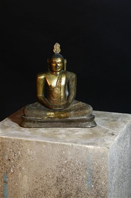 Lot 563 - A gilt bronze figure of a seated Buddha