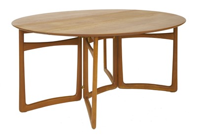 Lot 281 - A Danish teak drop-leaf dining table