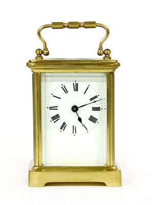 Lot 99 - A brass carriage clock