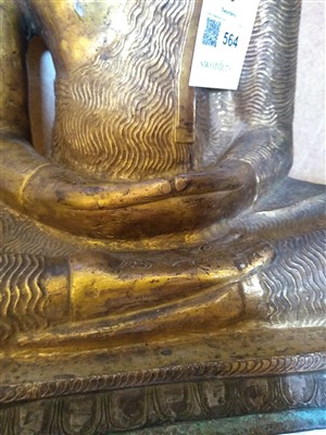 Lot 564 - A gilt bronze figure of Buddha