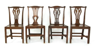 Lot 303 - A set of four George III country made elm dining chairs