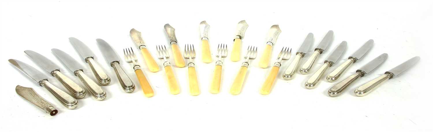Lot 49 - A collection of silver handled table knives
