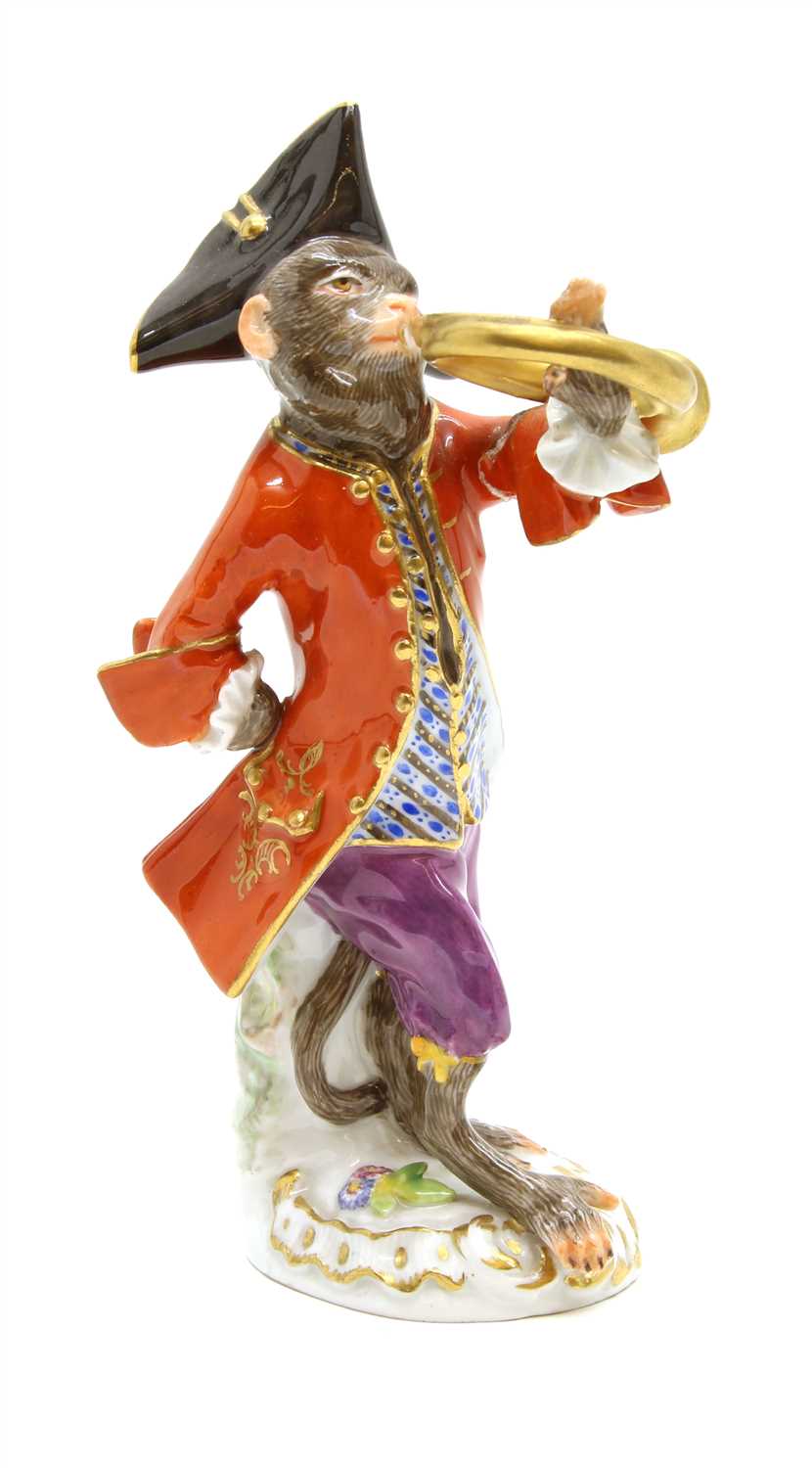 Lot 94 - A Meissen porcelain monkey band figure playing the French horn