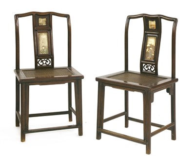 Lot 505 - A pair of Chinese hardwood chairs