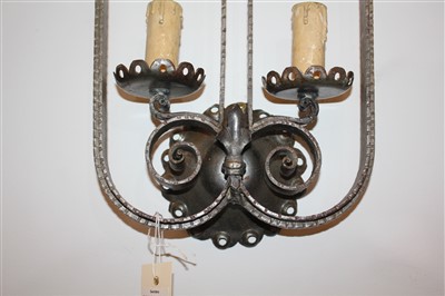 Lot 195 - A pair of French iron twin-branch wall lights