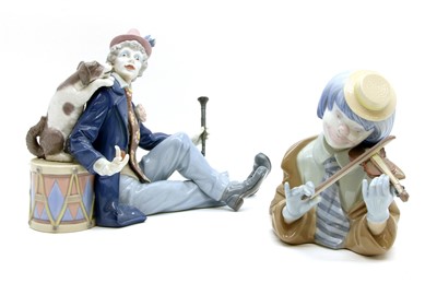 Lot 138 - A Lladro figure of a clown seated with a dog and drum