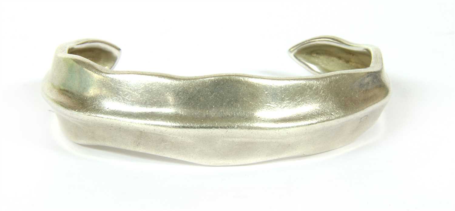Lot 21 - A sterling silver Tiffany open wave cuff bangle