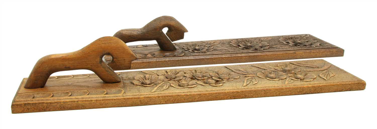 Lot 178 - A near pair of Scandinavian carved wooden mangle boards