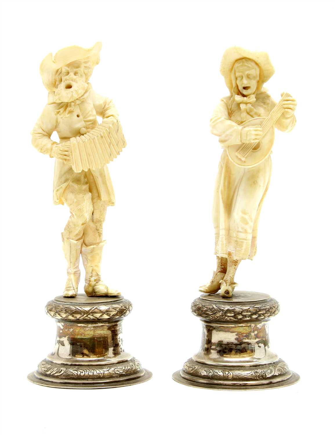 Lot 113 - A pair of late 19th century German silver and Ivory figures