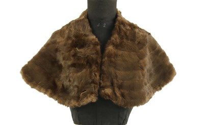 Lot 259 - An early 20th century velvet cape with fur edge, and three others