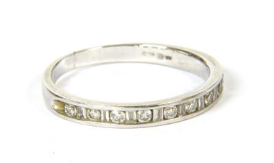 Lot 15 - An 18ct white gold diamond set half eternity ring