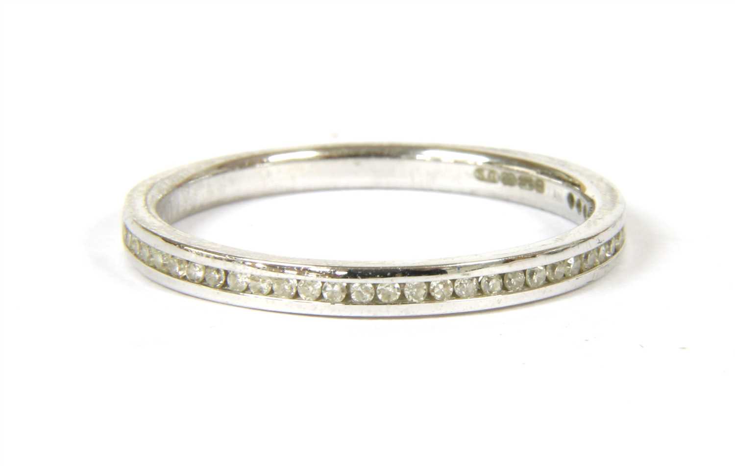 Lot 35 - An 18ct white gold diamond set half eternity ring