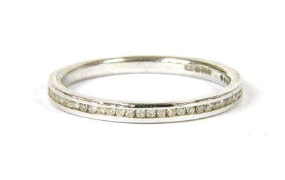Lot 35 - An 18ct white gold diamond set half eternity ring