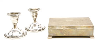 Lot 86 - A pair of silver candlesticks