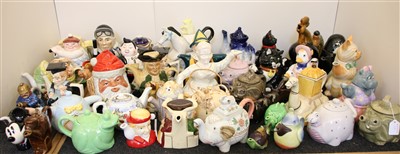 Lot 179 - A large collection of novelty teapots