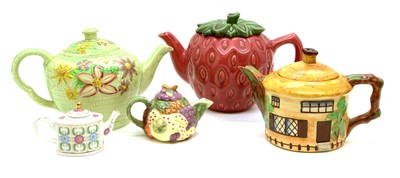Lot 186 - A large collection of approximately forty teapots