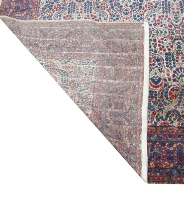 Lot 243 - A large Kirman carpet