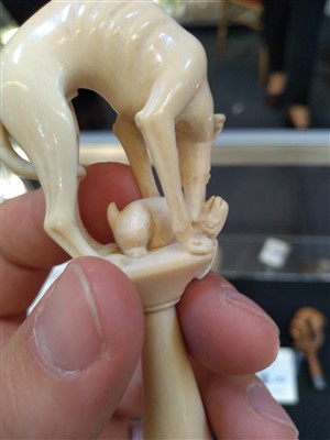 Lot 203 - A carved ivory pipe tamper
