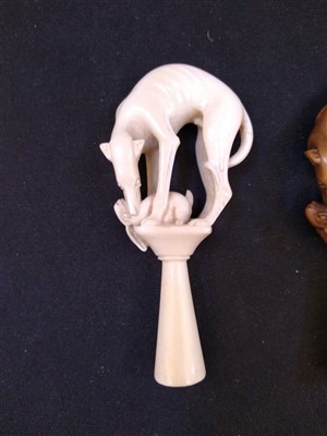 Lot 203 - A carved ivory pipe tamper