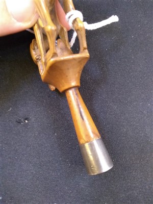 Lot 203 - A carved ivory pipe tamper