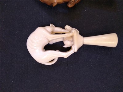 Lot 203 - A carved ivory pipe tamper