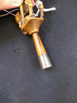 Lot 203 - A carved ivory pipe tamper