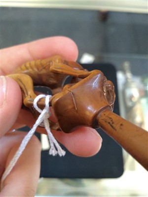 Lot 203 - A carved ivory pipe tamper