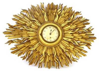 Lot 565 - A carved and gilt sunburst wall clock