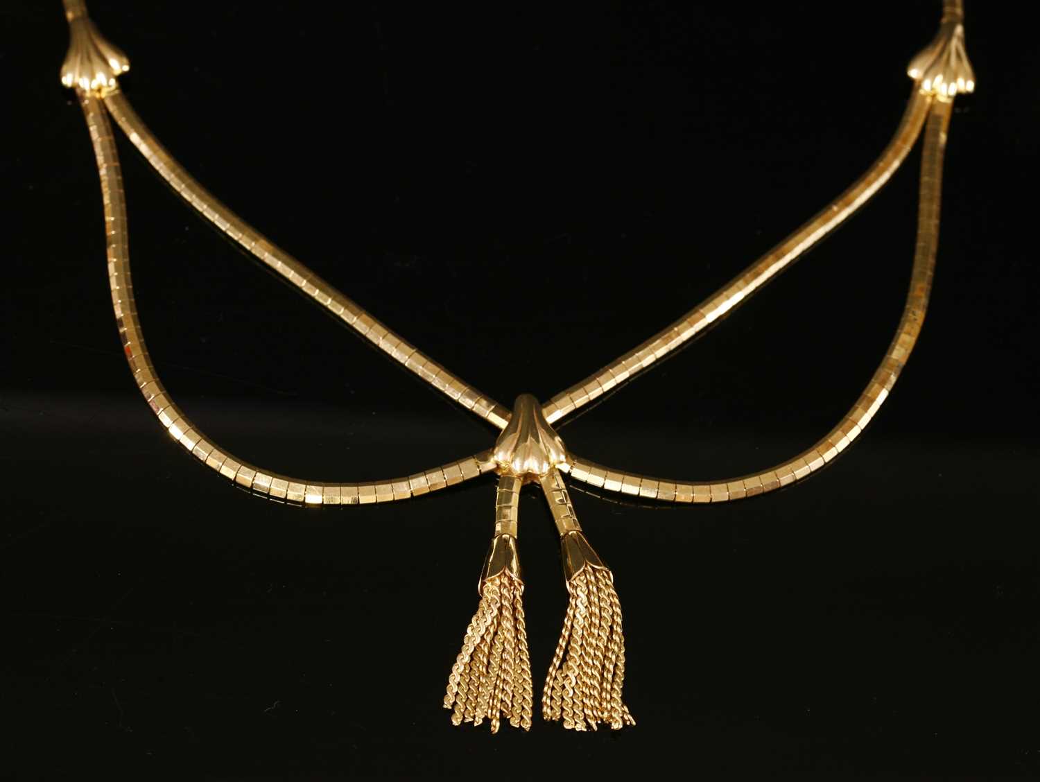 Lot 241 - An Italian gold swag and tassel necklace, c.1960