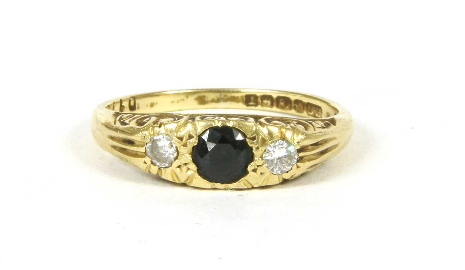 Lot 6 - A sapphire and diamond ring