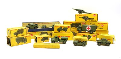 Lot 232 - Fourteen Dinky army toy vehicles and field guns