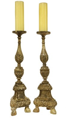 Lot 250 - A pair of Italian carved wooden pricket candlesticks