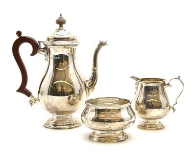 Lot 122 - A silver three piece coffee set comprising of coffee pot