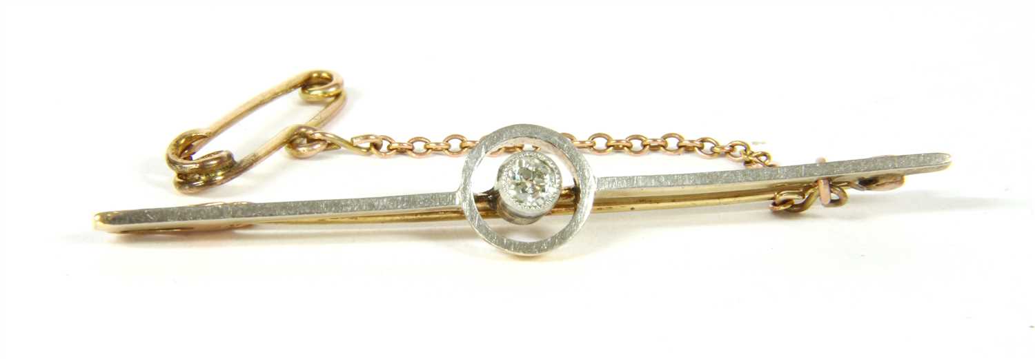 Lot 5 - A diamond set bar brooch