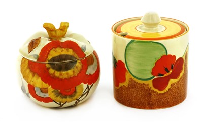 Lot 170 - Two Clarice Cliff preserve pots and covers
