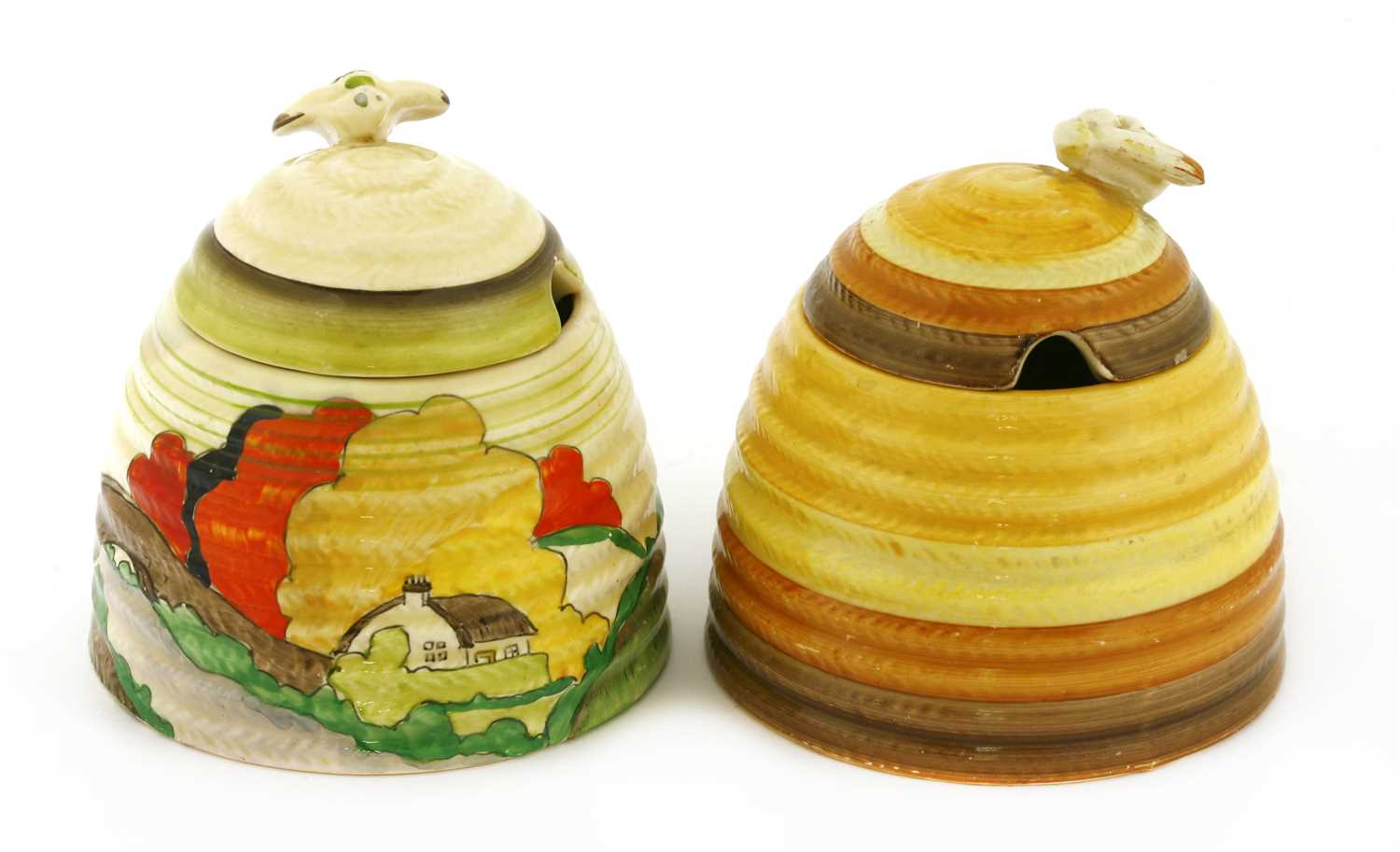 Lot 168 - Two Clarice Cliff beehive honeypots and covers
