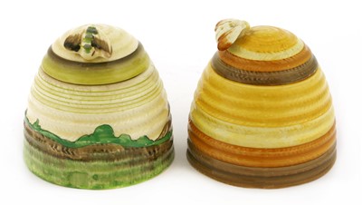 Lot 168 - Two Clarice Cliff beehive honeypots and covers