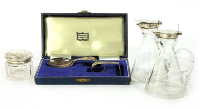 Lot 61 - Two silver topped whisky noggins