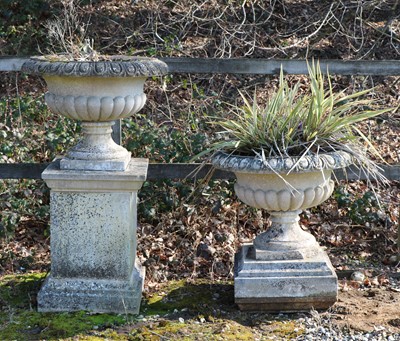 Lot 502 - A pair of composite stone urns